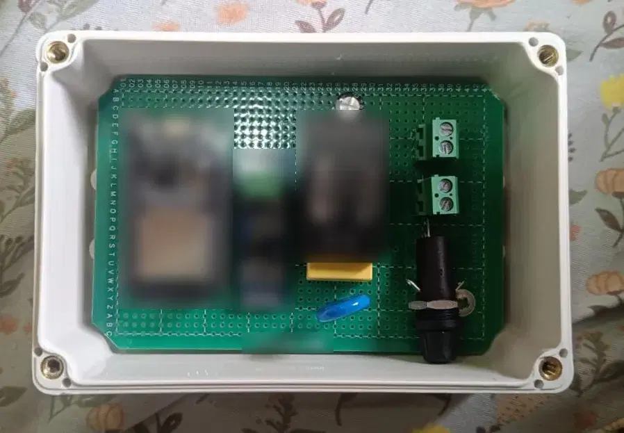 A Sucetas Edge Controller unit in its sealed enclosure, with component markings obscured