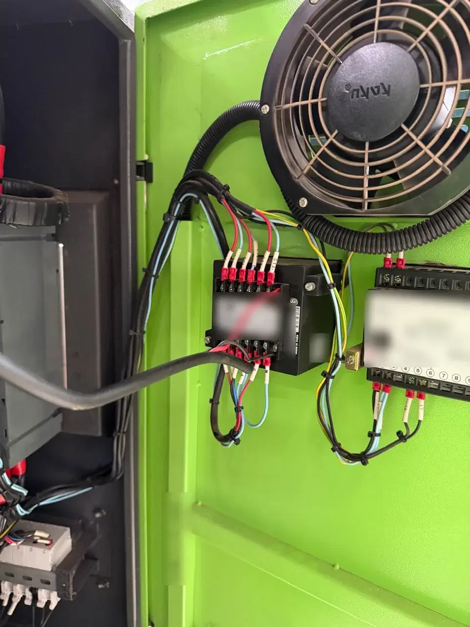 The electrical cupboard of an injection molding machine, showing the energy meter the Edge Controller reads from